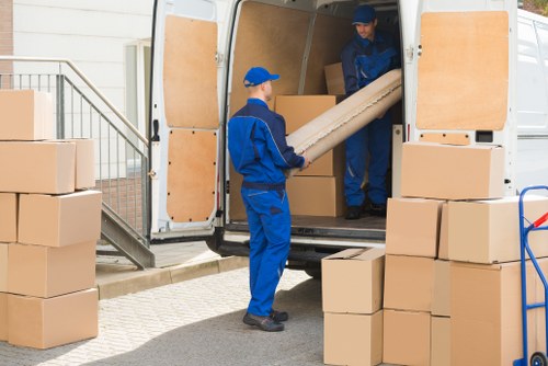 Removal team preparing a Burntoak home move with boxes and furniture