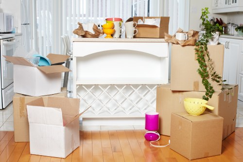 Careful wrapping and labeling of fragile items during a Burntoak move