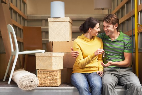 A local moving team organising boxes and furniture for a Burntoak relocation