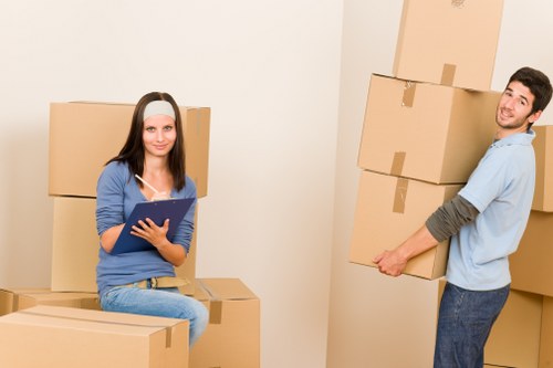 Staff using protective measures while moving items carefully