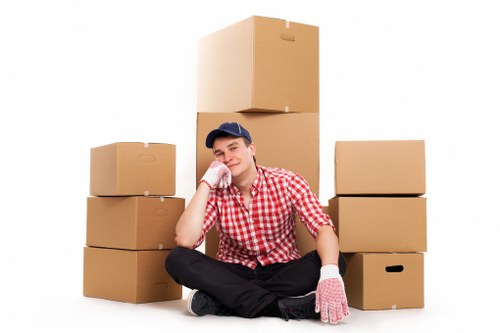 Local movers handling furniture in a Burntoak property